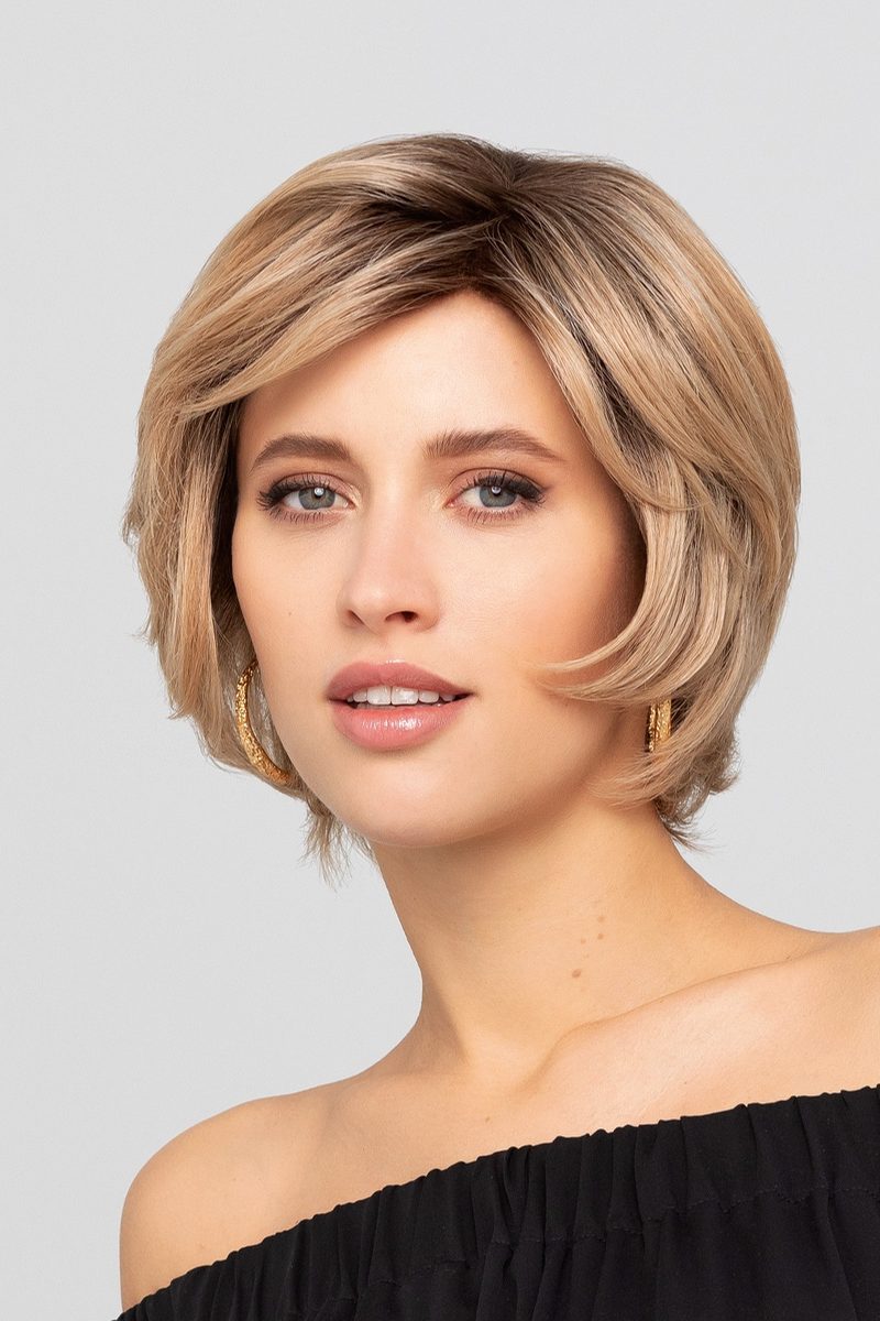 a woman with short blonde hair